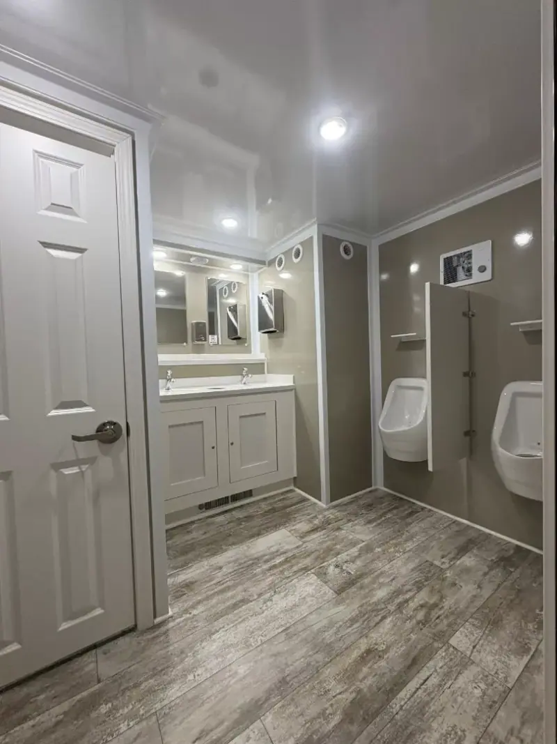 Men’s suite with two urinals and a double vanity