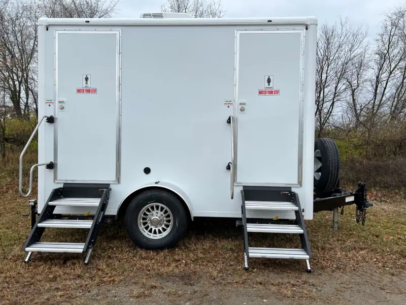 Two-room restroom trailer with men’s and women’s doors