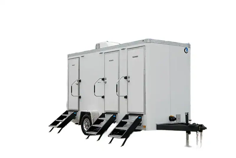 The 3 private room shower restroom and laundry trailer has three doors labeled "Women" or "Men," black steps, and is set against a plain white background.