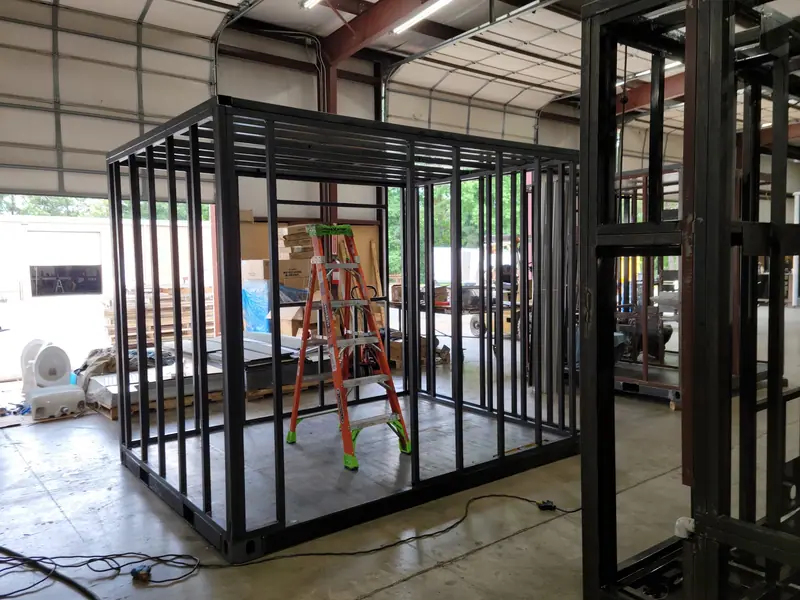 A finished steel body frame waiting for its walls