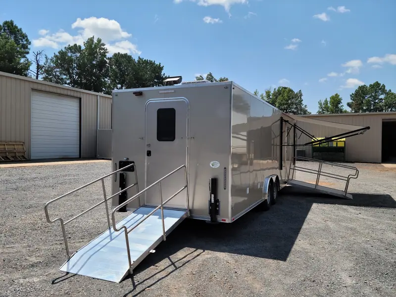 Locker and shower trailer with its awning and ramp set up