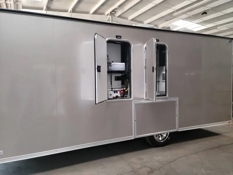 Equipment room doors open on the side of a shower trailer