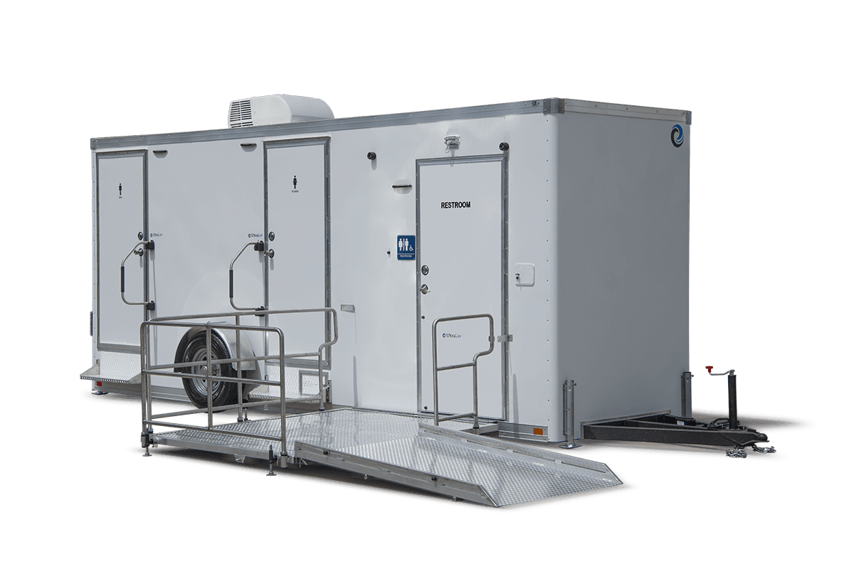 The ADA+4 Restroom Trailer offers multiple doors, metal handrails, and an access ramp, making it ideal for events or construction sites.
