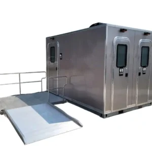 The CI 12 - 3 Stall ADA Restroom Skid (12 ft) is a portable restroom trailer featuring two doors and a metal accessibility ramp on the left side.